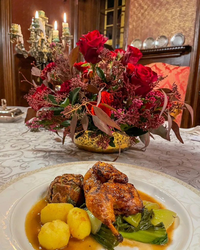 Roasted young rooster with chestnut stuffing and potatoes served at Chateau Loucen.